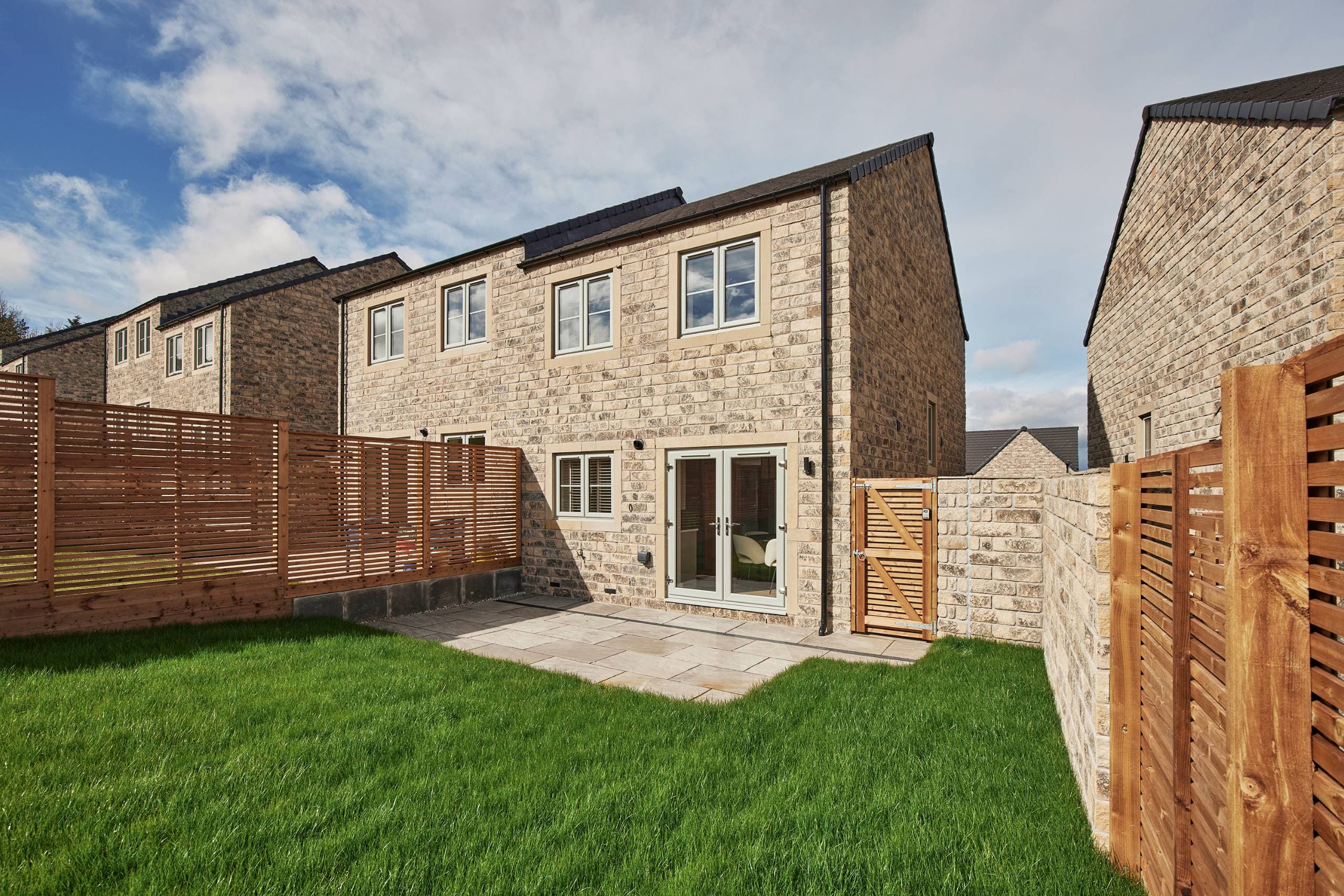 The rear garden and patio of The Cooper at The Alders, Skipton